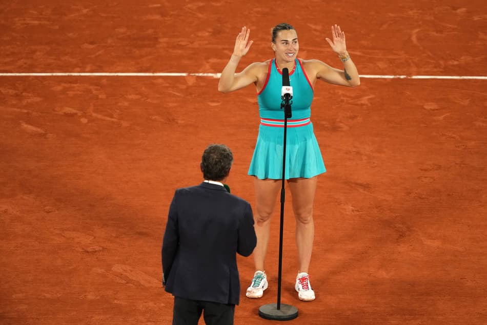 Winner Belarus' Aryna Sabalenka delivers a speech to spectators after winning against Poland's Iga Swiatek at the end of their women's singles semi-final match on day 12 of the French Open tennis tournament on Court Philippe-Chatrier at the Roland-Garros Complex in Paris on June 5, 2025. (Photo by Dimitar DILKOFF / AFP)