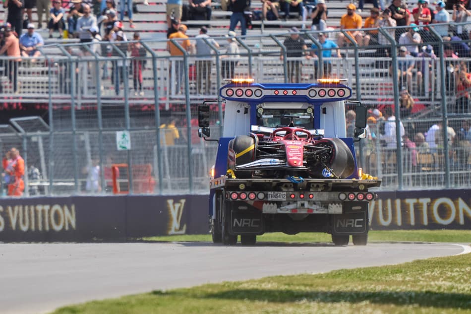 Ferrari's Monegasque driver Charles Leclerc's car is taken to the pits after he crashed during the first practice session for the 2025 Formula 1 Grand Prix du Canada at Circuit Gilles-Villeneuve in Montreal, Canada, on June 13, 2025. (Photo by Geoff Robins / AFP)