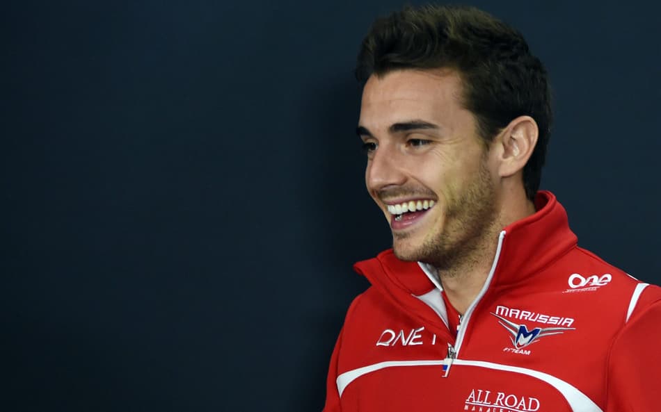 This October 2, 2014 picture shows Marussia driver Jules Bianchi of France smiling after FIA official press conference for the Japanese Formula One Grand Prix in Suzuka. The French driver underwent emergency surgery on October 5 after slamming into a recovery vehicle on the Suzuka track near the end of a rain-sodden Japanese Grand Prix. AFP PHOTO / TOSHIFUMI KITAMURA
