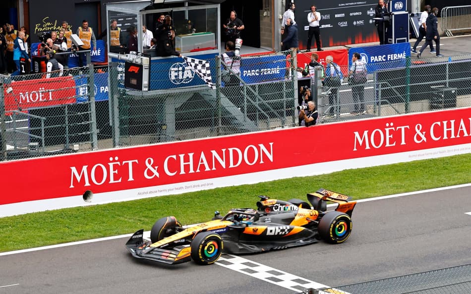 McLaren's Australian driver Oscar Piastri crosses the finish line to win the Formula One Belgian Grand Prix at the Spa-Francorchamps circuit in Spa, on July 27, 2025. (Photo by SIMON WOHLFAHRT / AFP)