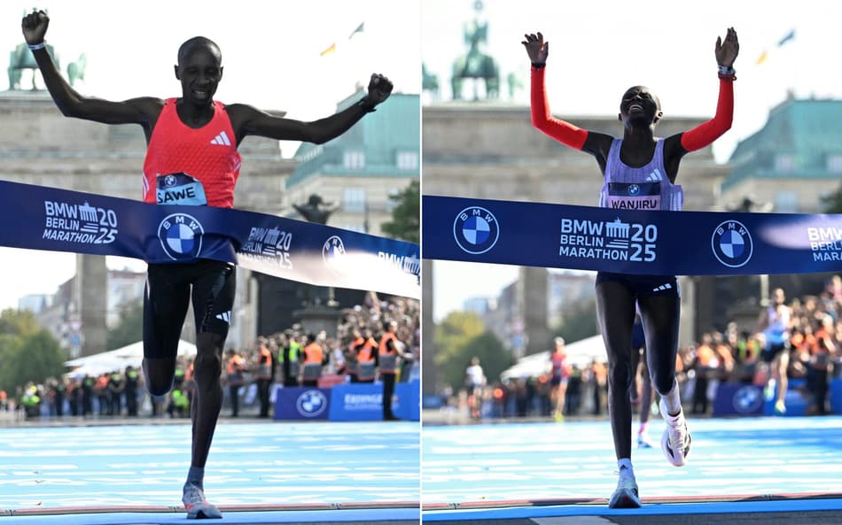 Sabastian Sawe e Rosemary Wanjiru, do Quênia, cruzando a linha de chegada da Maratona de Berlim 2025 (Foto: Tobias Schwarz/AFP)