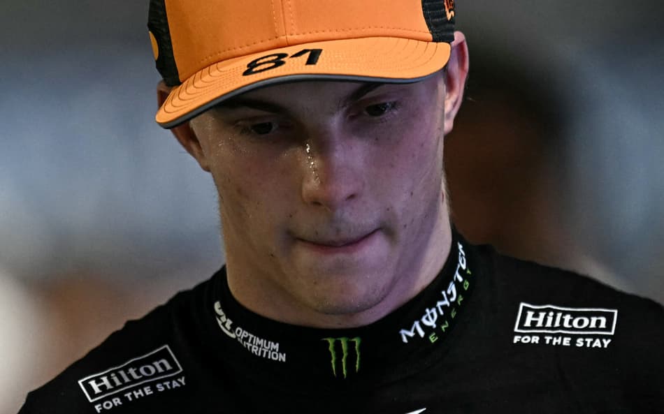 Third-placed McLaren's Australian driver Oscar Piastri looks after the qualifying session for the Formula One Singapore Grand Prix night race at the Marina Bay Street Circuit in Singapore on October 4, 2025. (Photo by Lillian SUWANRUMPHA / AFP)