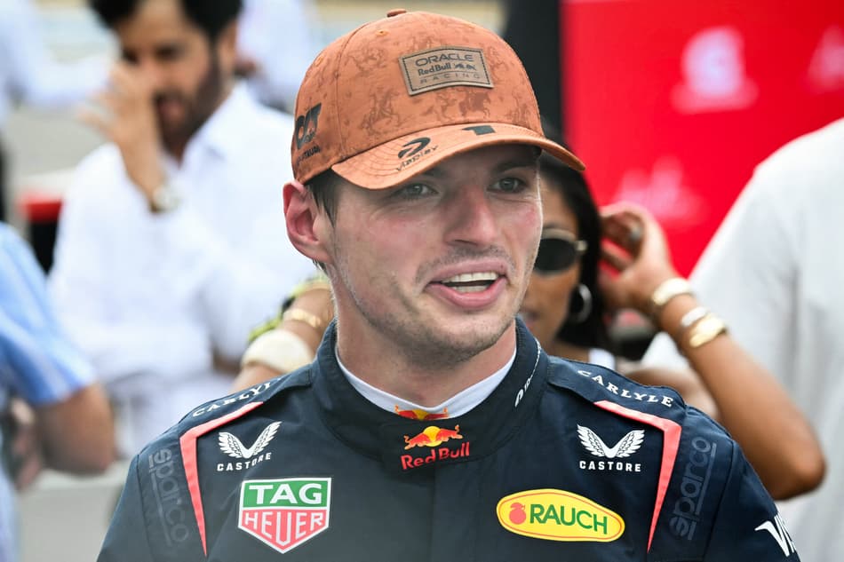 Red Bull Racing's Dutch driver Max Verstappen walks to the podium after winning the United States Formula One Sprint at the Circuit of the Americas in Austin, Texas, on October 18, 2025. (Photo by RONALDO SCHEMIDT / AFP)
