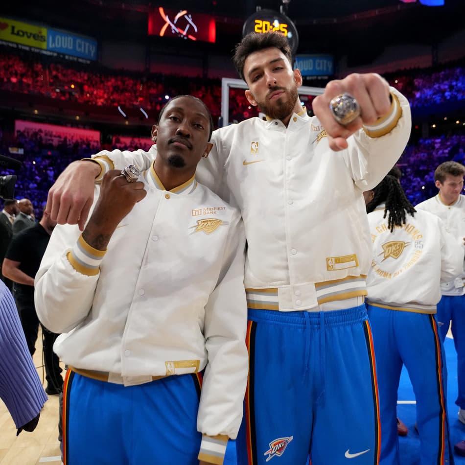 OKLAHOMA CITY, OK - OCTOBER 21: Jalen Williams #8 and Chet Holmgren #7 of the Oklahoma City Thunder pose for a photo after receiving their 2024-2025 NBA championship ring before the game against the Houston Rockets on October 21, 2025 at Paycom Center in Oklahoma City, Oklahoma. NOTE TO USER: User expressly acknowledges and agrees that, by downloading and or using this photograph, User is consenting to the terms and conditions of the Getty Images License Agreement. Mandatory Copyright Notice: Copyright 2025 NBAE Jesse D. Garrabrant /NBAE via Getty Images/AFP (Photo by Jesse D. Garrabrant / NBAE / Getty Images / Getty Images via AFP)