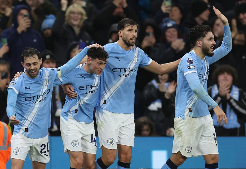 Jogadores do Manchester City comemrando o gol marcado pela Premier League (Foto: Darren Staples/AFP)
