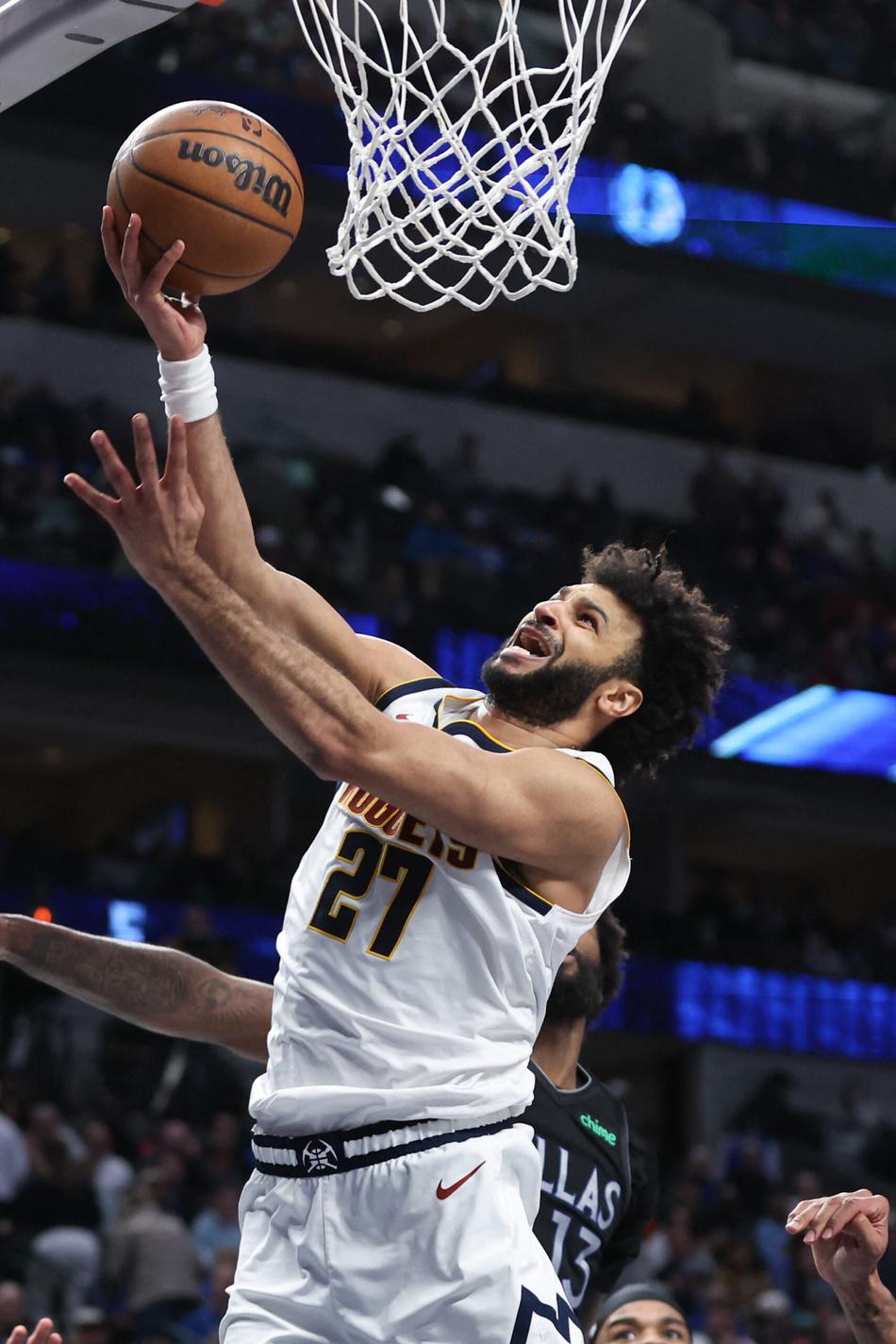 Jamal Murray, do Denver Nuggets, durante jogo contra o Dallas Mavericks em 14 de janeiro de 2026, em Dallas. (Foto: Tim Heitman/NBAE/Getty Images/AFP)