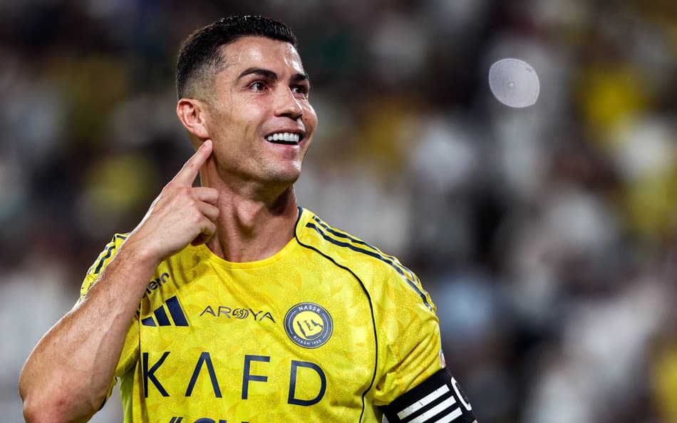 Cristiano Ronaldo comemorando o segundo gol marcado (Foto: Fayez Nureldine/AFP)