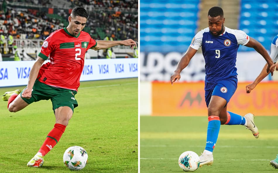 Achraf Hakimi, jogador do Marrocos (lado esquerdo), e o atacante do Haiti, Duckens Nazon (lado esquerdo). Equipes se enfrentam nesta quarta-feira (24), pela Copa do Mundo (Foto: Sia KAMBOU and Cooper NEILL / AFP).