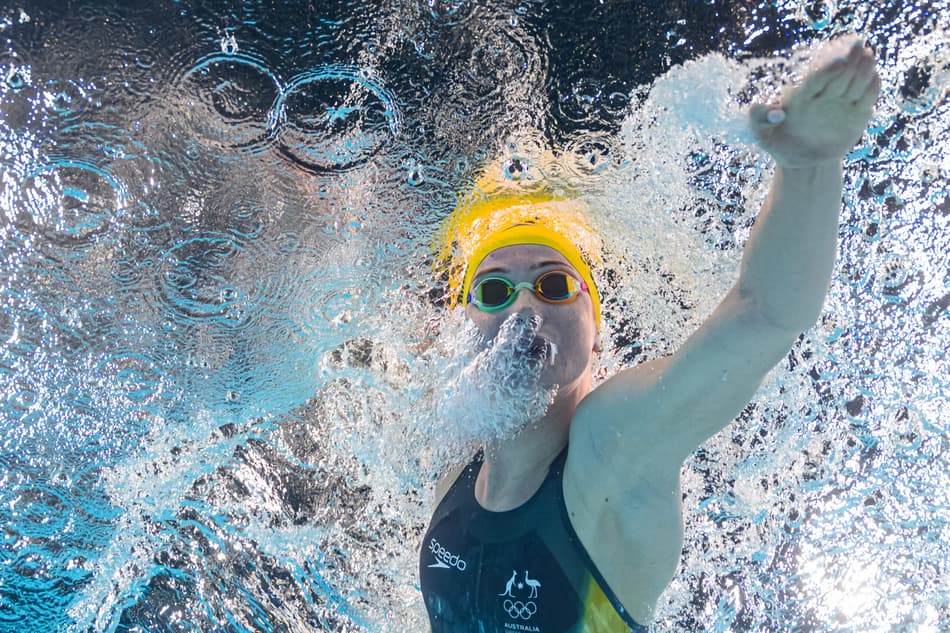 An underwater view shows Australia's Mollie O'callaghan competing in a semifinal of the women's 200m freestyle swimming event during the Paris 2024 Olympic Games at the Paris La Defense Arena in Nanterre, west of Paris, on July 28, 2024. (Photo by François-Xavier MARIT / AFP)