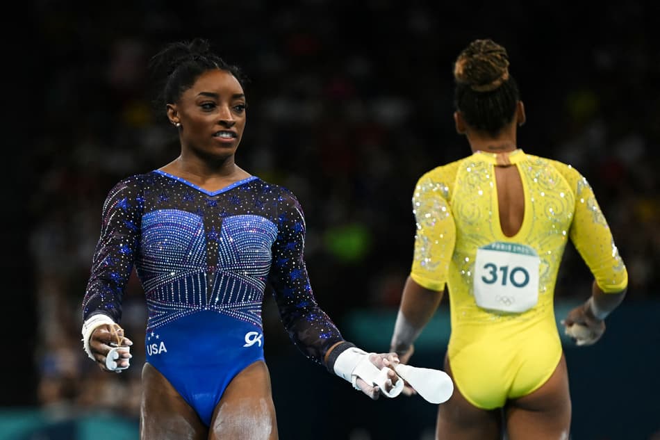 US' Simone Bile (L) and Brazil's Rebeca Andrade