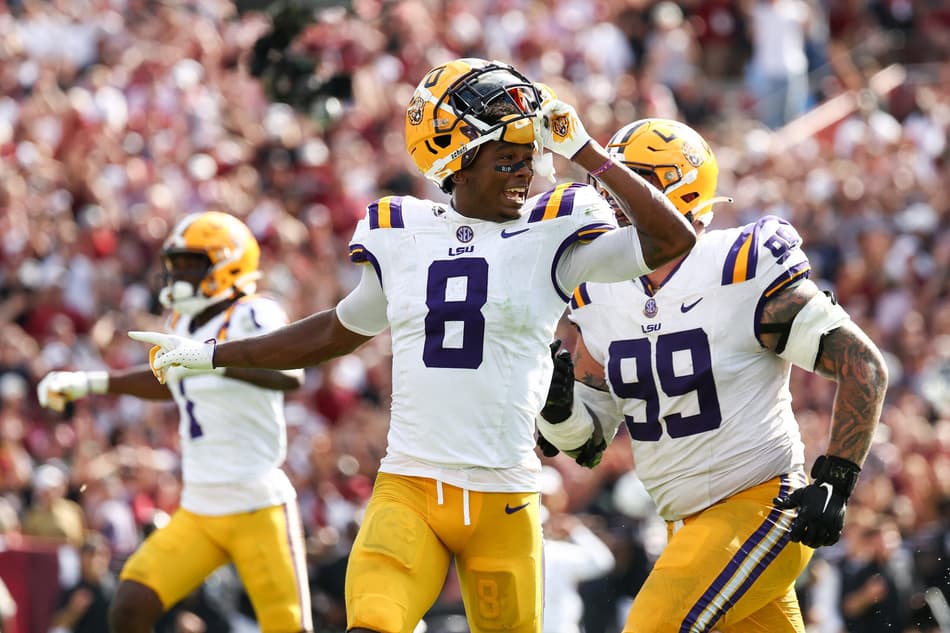 COLUMBIA, SOUTH CAROLINA - SEPTEMBER 14: Major Burns #8 of the LSU Tigers and Gio Paez #99 of the LSU Tigers celebrate after blocking the kick to defeat the South Carolina Gamecocks at Williams-Brice Stadium on September 14, 2024 in Columbia, South Carolina. The LSU Tigers defeat the South Carolina Gamecocks, 36-33. Isaiah Vazquez/Getty Images/AFP (Photo by Isaiah Vazquez / GETTY IMAGES NORTH AMERICA / Getty Images via AFP)
