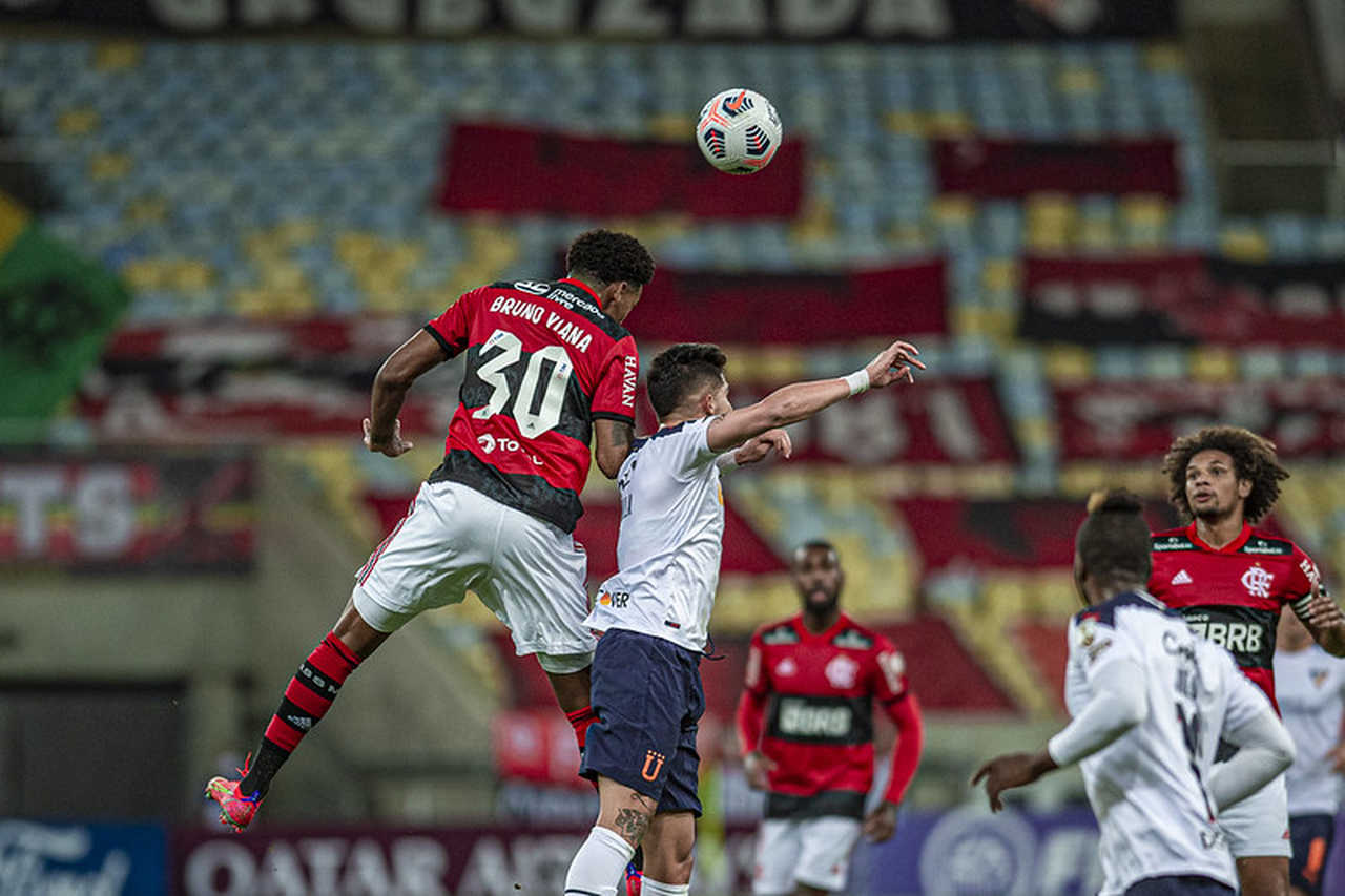 Gustavo Henrique of Brazil's Flamengo, top, heads the ball as